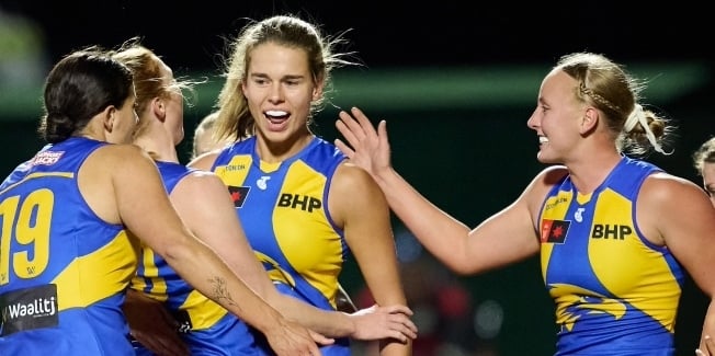 West Coast Eagles women players congratulating each other on the pitch