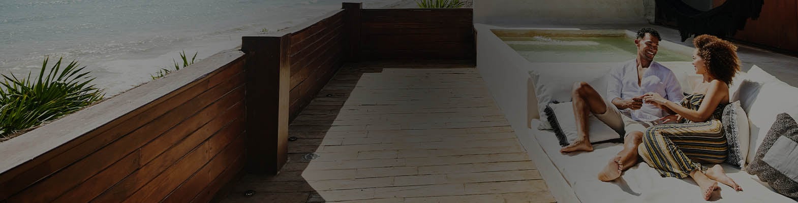 A happy couple relaxing at a beachside hotel