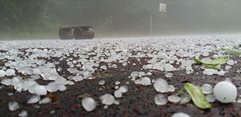 Hail covering a road. 