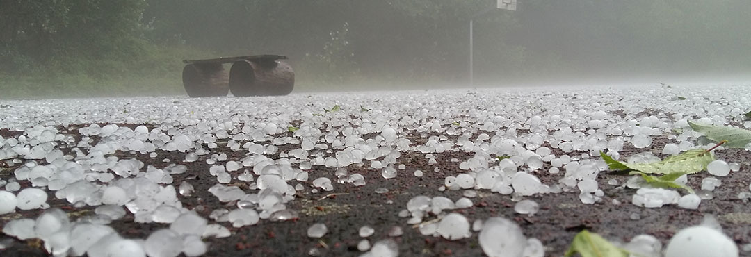 Hail covering a road.