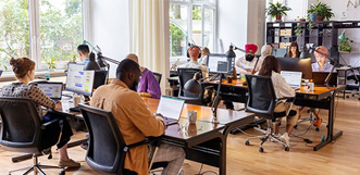 Workers sitting at their desks in an office