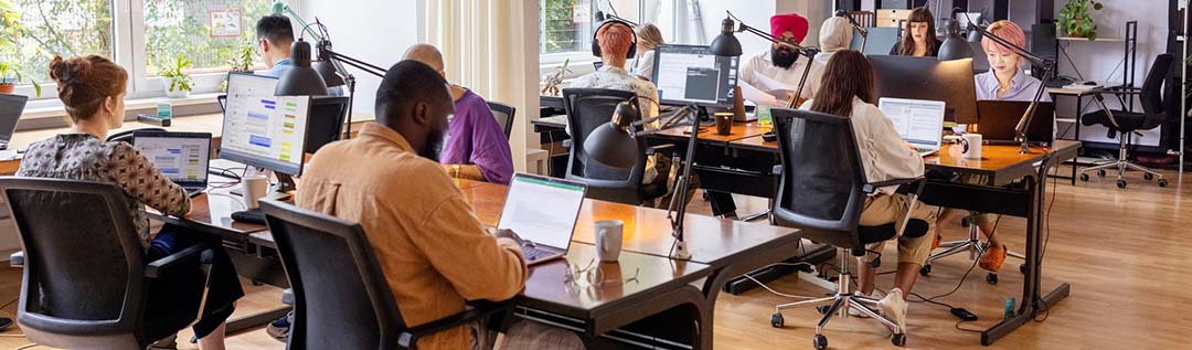 A group of office workers working at their desks