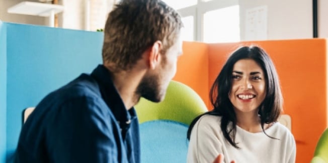 Colleagues talking in the office