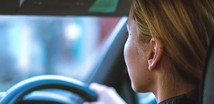 A woman driving a car