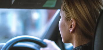 A woman driving a car