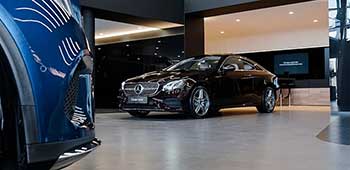 New car on display inside a dealership showroom