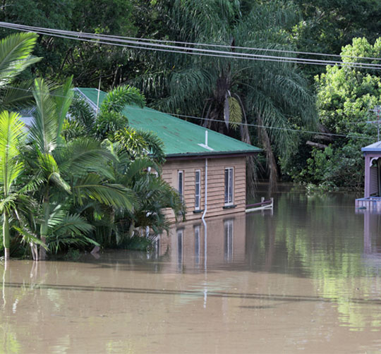 Weatherboard house in floodwaters 