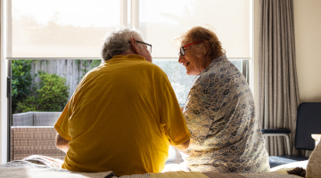 An ealderly couple chatting 