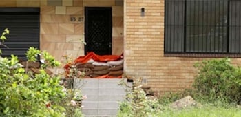 Sandbags covering a front door