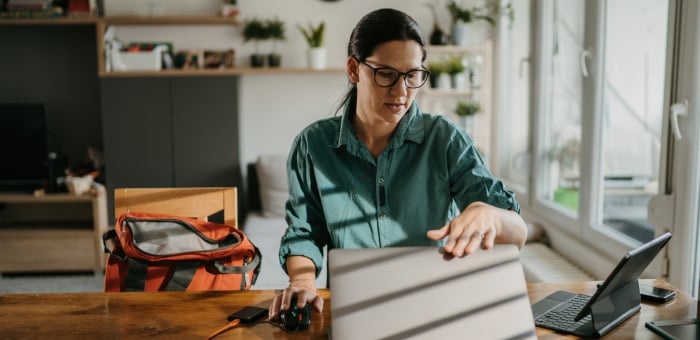 a woman testing a battery on her dining table