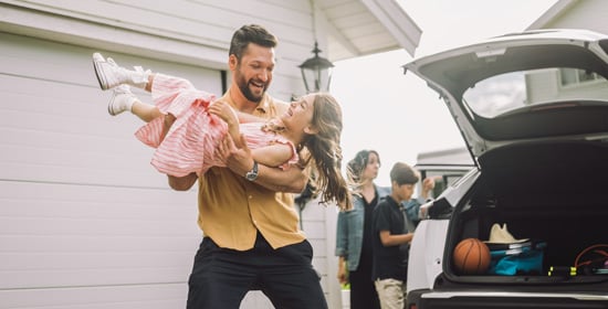 Man holding a young girl 