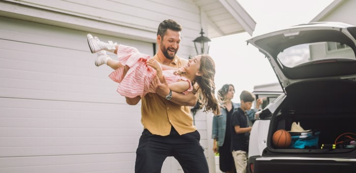 Man holding a young girl 