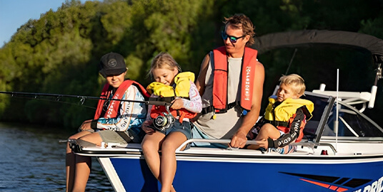 Family fishing on a boat