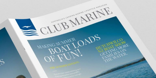 Single edition of Club Marine magazine opened with front cover visible