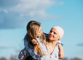 Woman giving a child a piggyback