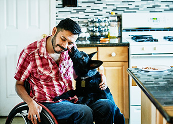 Man in a wheelchair with his dog