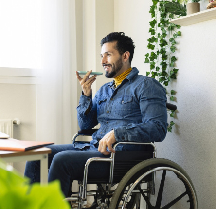Man in a wheelchair talking on his mobile phone