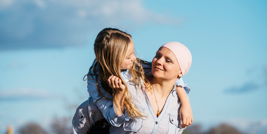 Woman giving a piggyback to a child