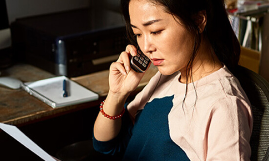 A woman using her mobile phone.