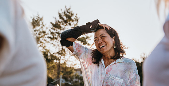 smiling woman at the end of a colour run