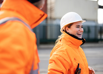 man and woman in high vis jackets