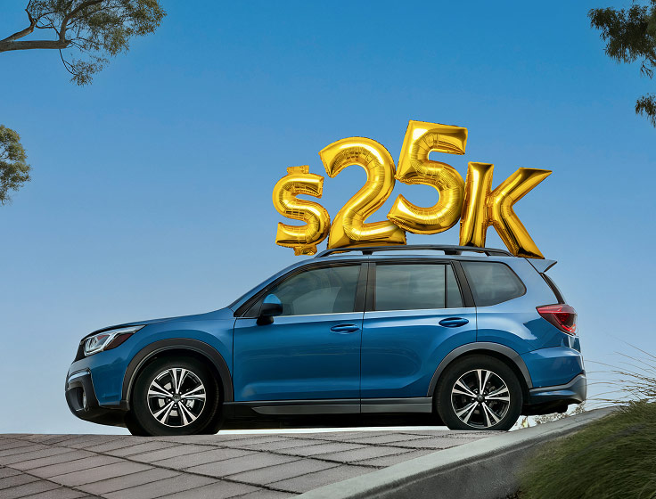 25K balloon over a car