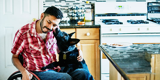 Man in a wheelchair with his dog